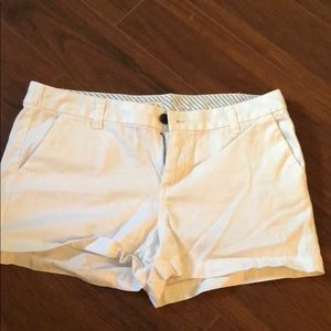 White shorts, medium length, stretchy